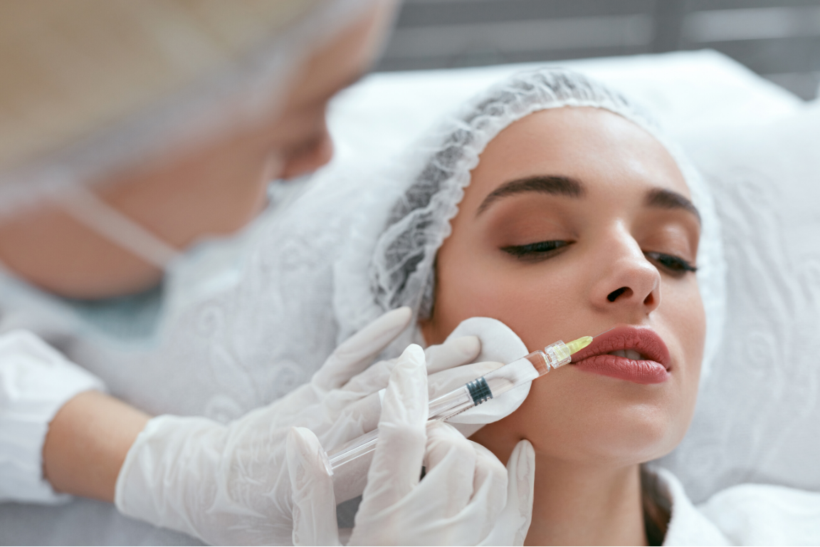 Close up of a trainee administering a lip injection at APT