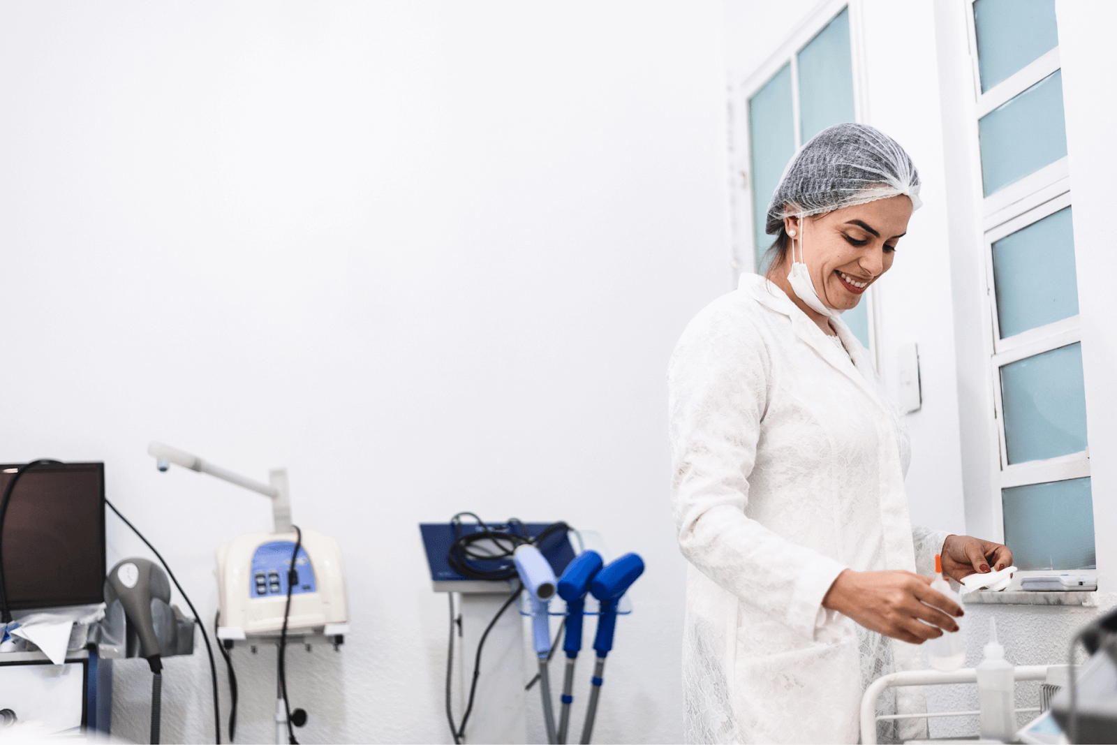 A medical aesthetician in a med spa with laser equipment