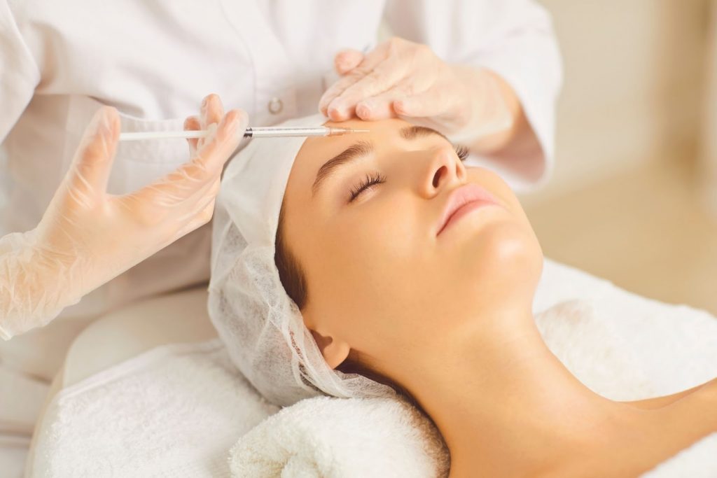 A woman receiving Botox injection treatment