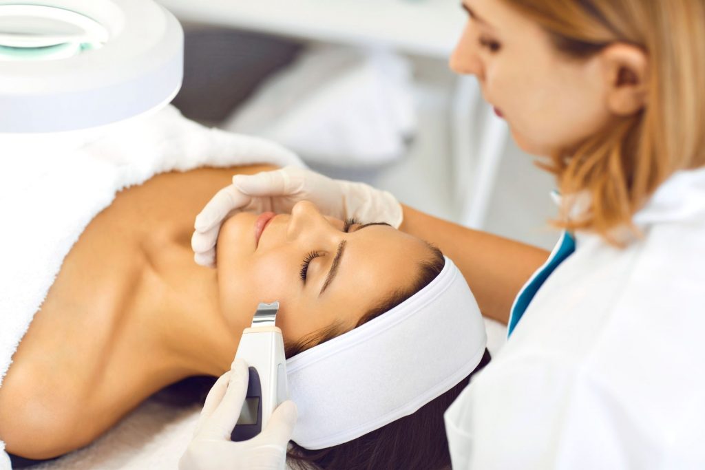 A woman receiving laser therapy