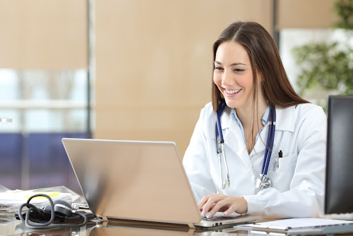 Female doctor taking medical aesthetics training online.