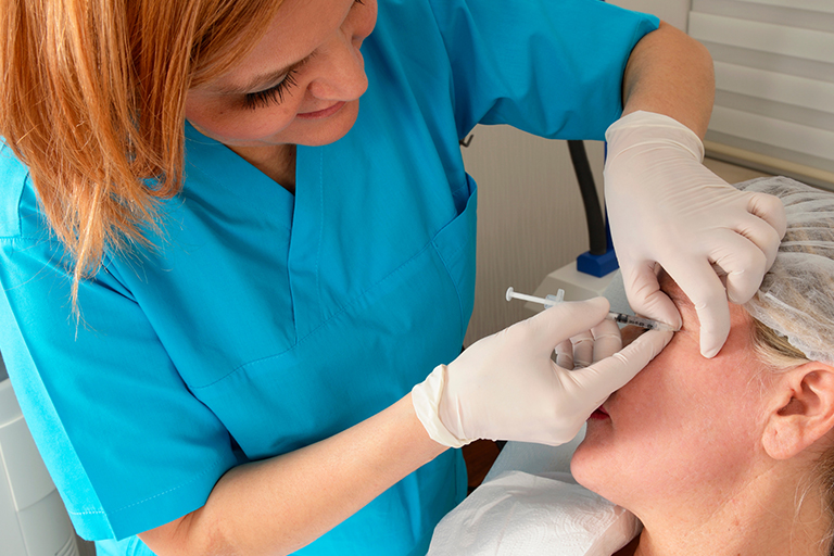 A nurse practitioner administering Botox