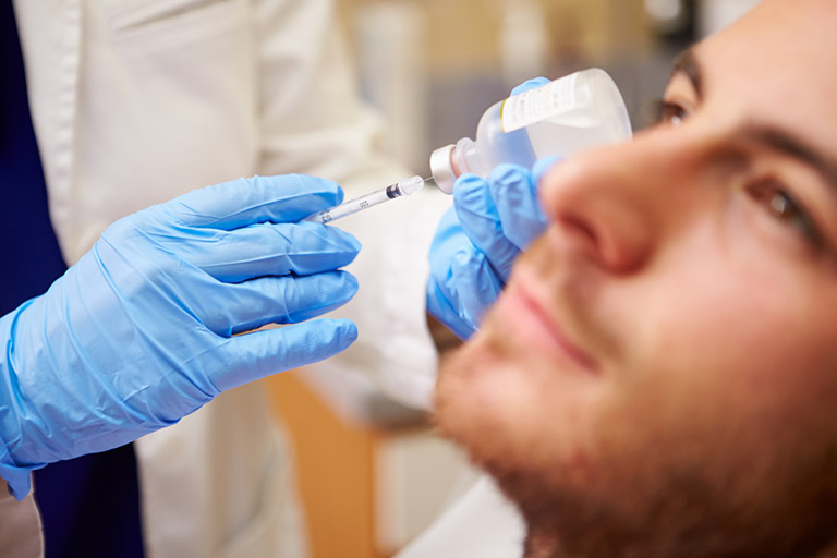 a man receiving a Botox injection