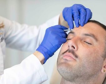 a male patient receiving Botox injections
