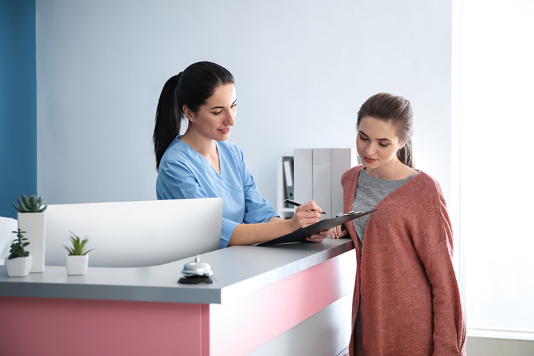  a client reviewing consent forms at a med spa