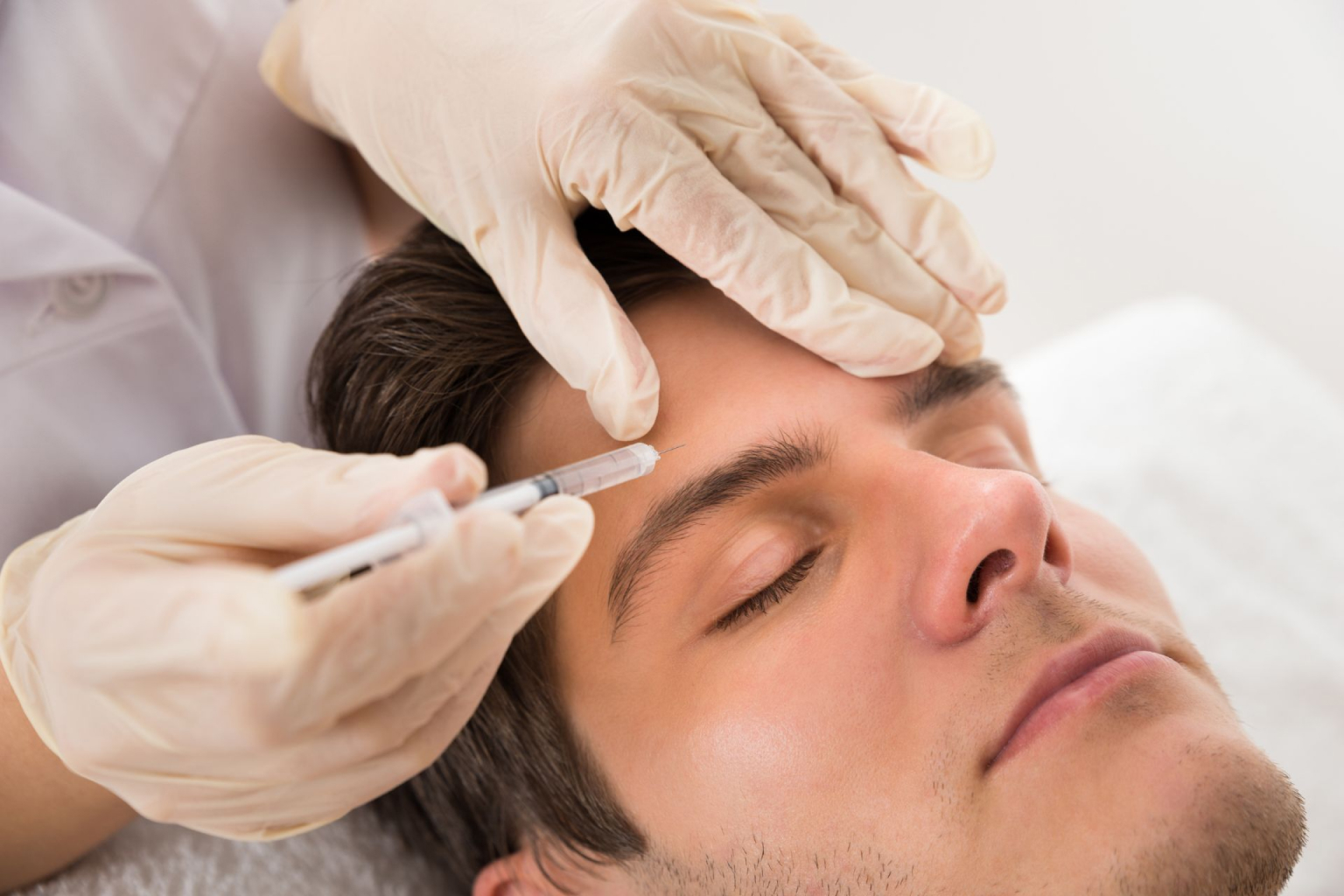 A man receiving a Botox injection