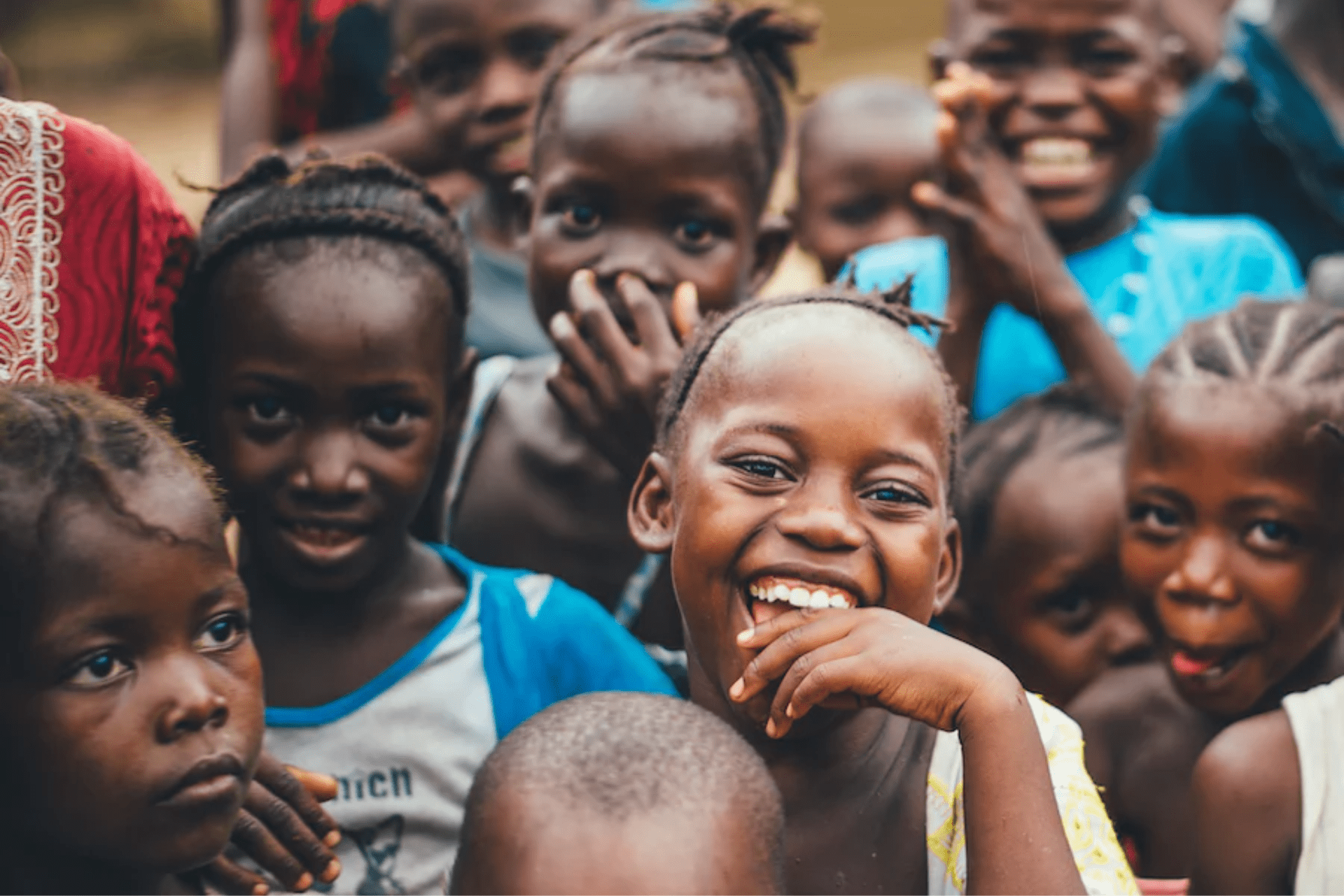 A group of children smiling at the camera 