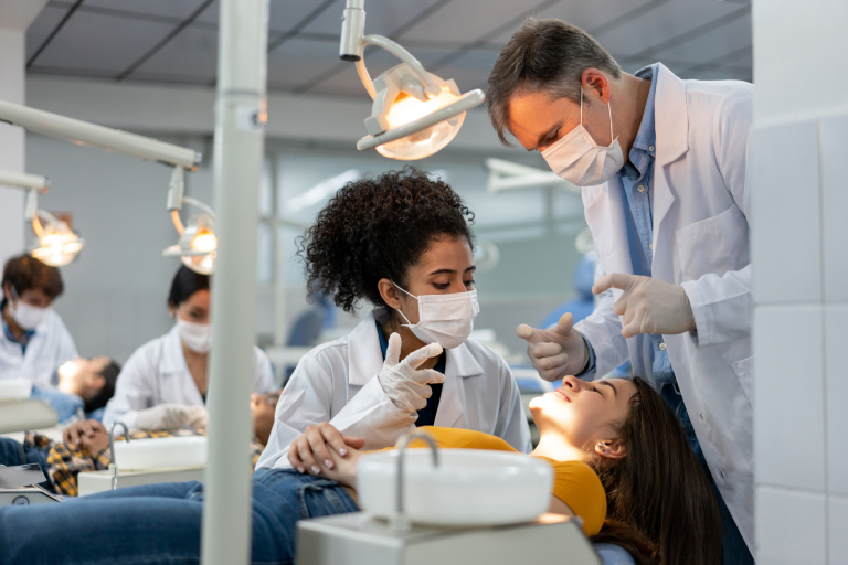 A dental professional learning how to perform Botox on a live model 