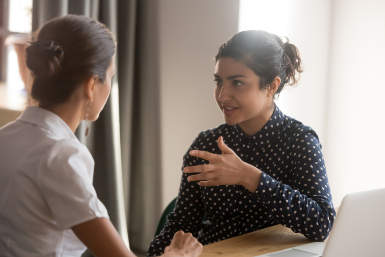 an aspiring aesthetic nurse speaking with an experienced injector 