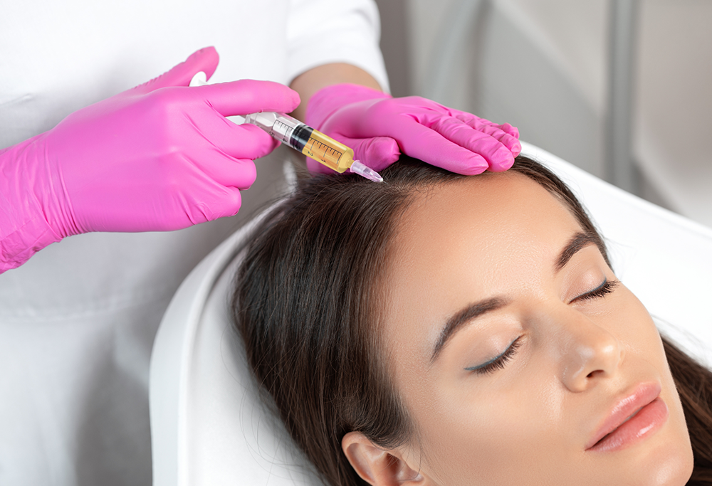 A female patient receiving scalp injection from a medical practitioner
